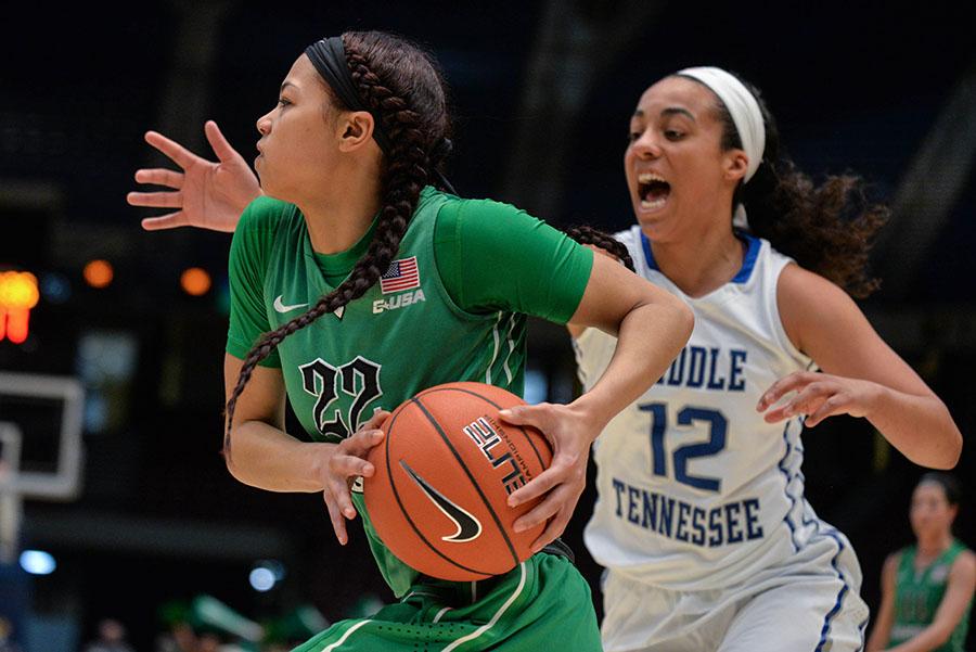 Marshall's Kiana Evans rushes toward the hoop for a two-point shot as the Herd takes on Middle Tennessee for the C-USA Women’s Basketball Semi Finals on Friday in Birmingham, AL.