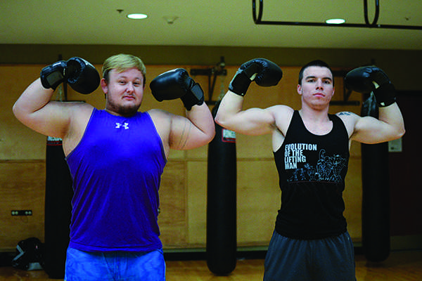 Lifelong friends Jerry Haycraft, sophomore, and Thomas Canterbury, freshman, train in preparation of the Rough N Rowdy boxing competition on Wednesday at the Rec Center.