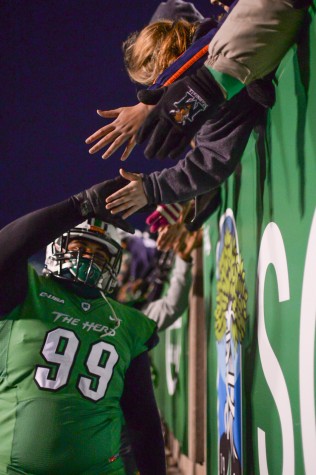 Marshall's players shake hands with fans after the Herd defeats Rice University on Saturday, Nov. 15 at the Joan C. Edwards Stadium.
