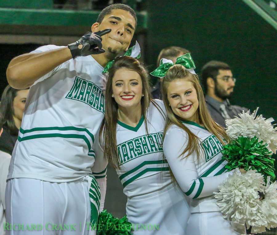 Marshall cheerleaders cheer on the Herd men's basketball team as it falls the Morehead State University Wednesday at the Cam Henderson Center. 