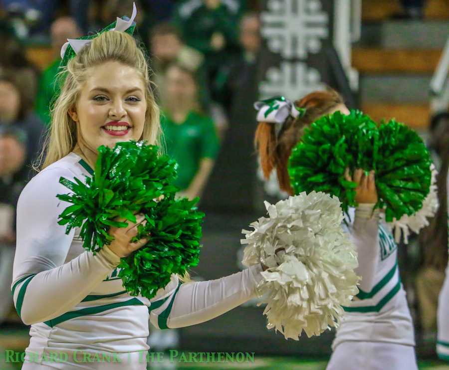 Marshall cheerleaders cheer on the Herd men's basketball team as it falls the Morehead State University Wednesday at the Cam Henderson Center. 