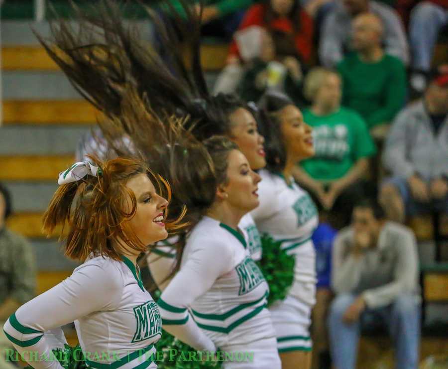 Marshall cheerleaders cheer on the Herd men's basketball team as it falls the Morehead State University Wednesday at the Cam Henderson Center. 