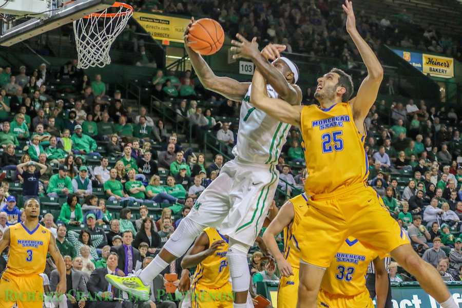 Marshall's Shawn Smith and Morehead State's Karam Mashour battle for ball as the Herd falls to the Eagles Wednesday at the Cam Henderson Center. 