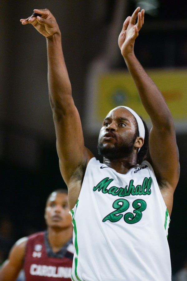 Marshall’s Justin Edmonds scores as the Herd men’s basketball team takes on the South Carolina Gamecocks Dec. 1, 2014 at the Cam Henderson Center.