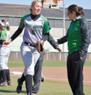 Alyssa Woodrum (left) takes the field prior
to a game against Miami (Ohio) at Dot
Hicks Field March 26, 2014.