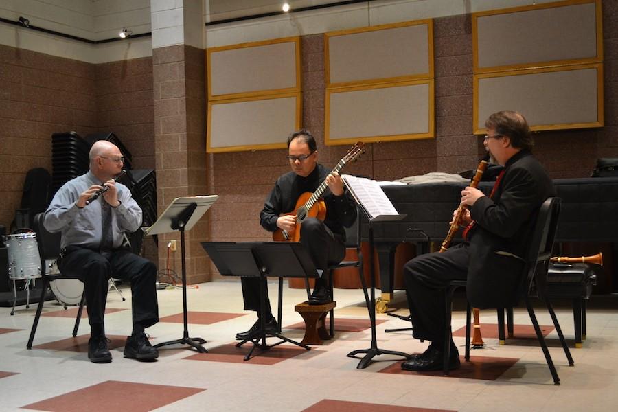 Wendell Dobbs (left), flute and theory professor, Júlio Alves, guitar and theory professor, and guest clarinetist  Richard Spece perform at the Jomie Jazz Center Tuesday.