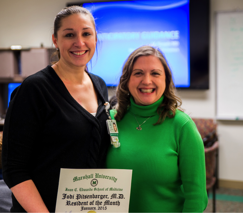 Dr. Jodi M. Pitsenbarger, (left) receives the Resident of the Month Award