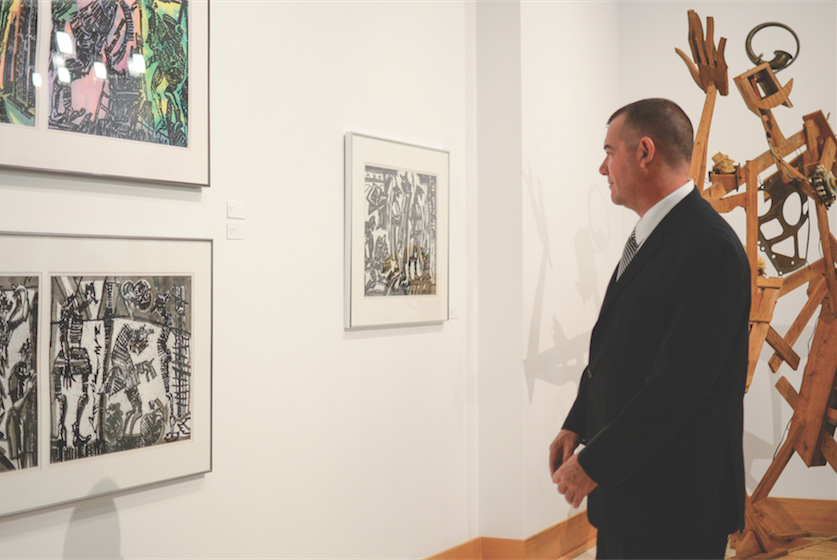 Guests attend the grand opening of Marshall University’s Visual Arts Center Sept. 20, 2014. The VAC gallery continues to feature a wide variety of national art.