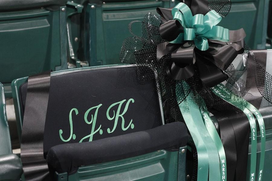 Former Marshall President Stephen J. Kopp’s seat in the Cam Henderson Center is decorated with embroidery and a commemorative ribbon at the memorial service January 13.
