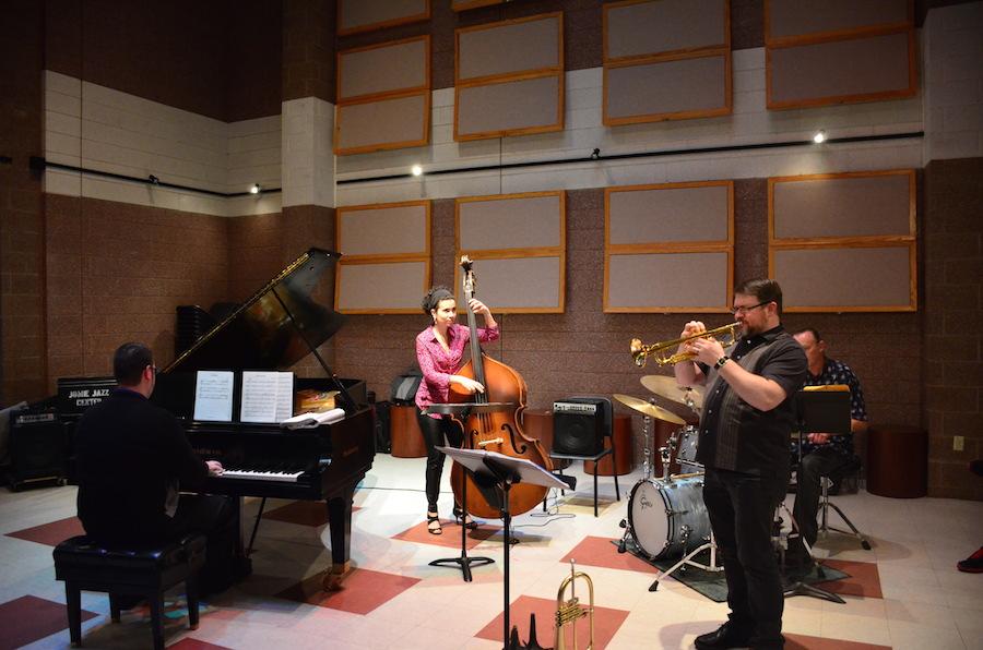 Natalie Boeyink plays the bass with Zach Arbogast on piano and Steve Hall on drums Wednesday at the Jomie Jazz Center.