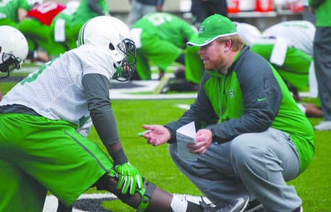 The 2015 Marshall University football team starts drills during its first spring practice Tuesday at the Joan C. Edwards Stadium.