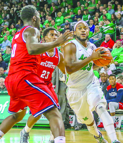 Justin Edmonds defends the ball against Florida Atlantic University Saturday. 