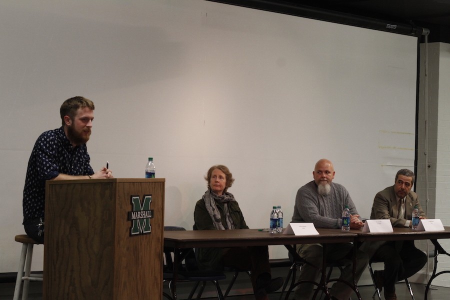 Rabbi Jean Eglington, second from left, professor Larry Bailey and professor Majed Khader join Marshall University students for a religious studies panel Wednesday in the basement of the Memorial Student Center.