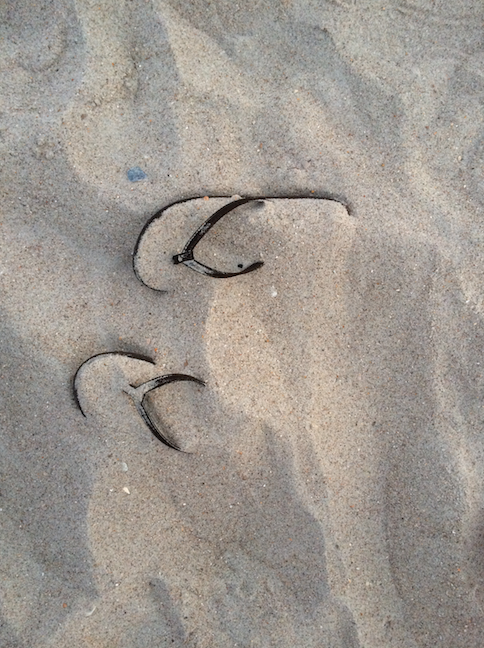 This summer memory photo shows flip flops buried on a sandy beach in North Carolina.