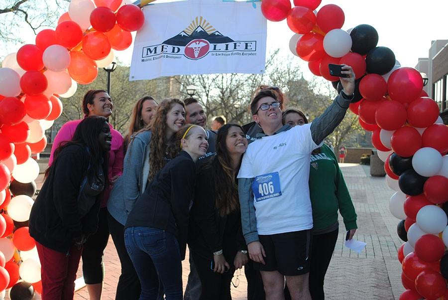 Marshall+Medlife+Members+pose+for+a+selfie+at+the+finish+line+of+the+Medlife+5k+on+Marshalls+campus+Saturday.+