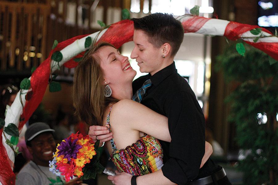 Samantha Lengyel and Jenna Jenkins, sophomore accounting and finances majors, participate in Marriage Day inside of the Memorial Student Center Monday.