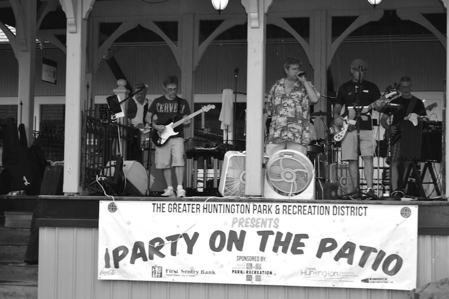 Jeff Faucette leads the Oakwood Road Band as they play classic rock songs for Party on the Patio at Heritage Station. 