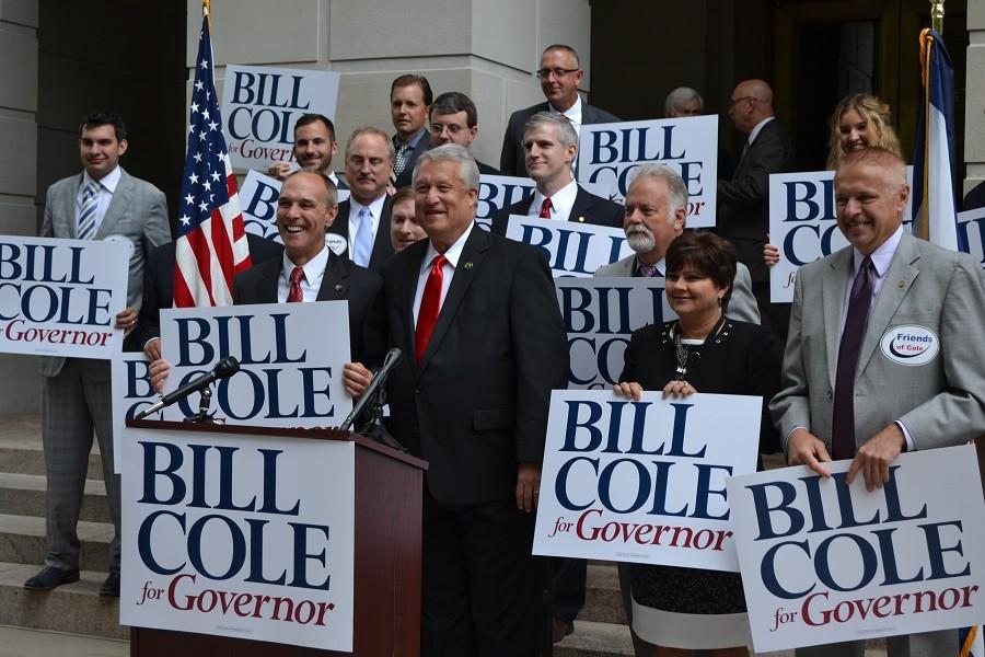 Senator Carmichael and other legislators showing support for Coles announcement. 