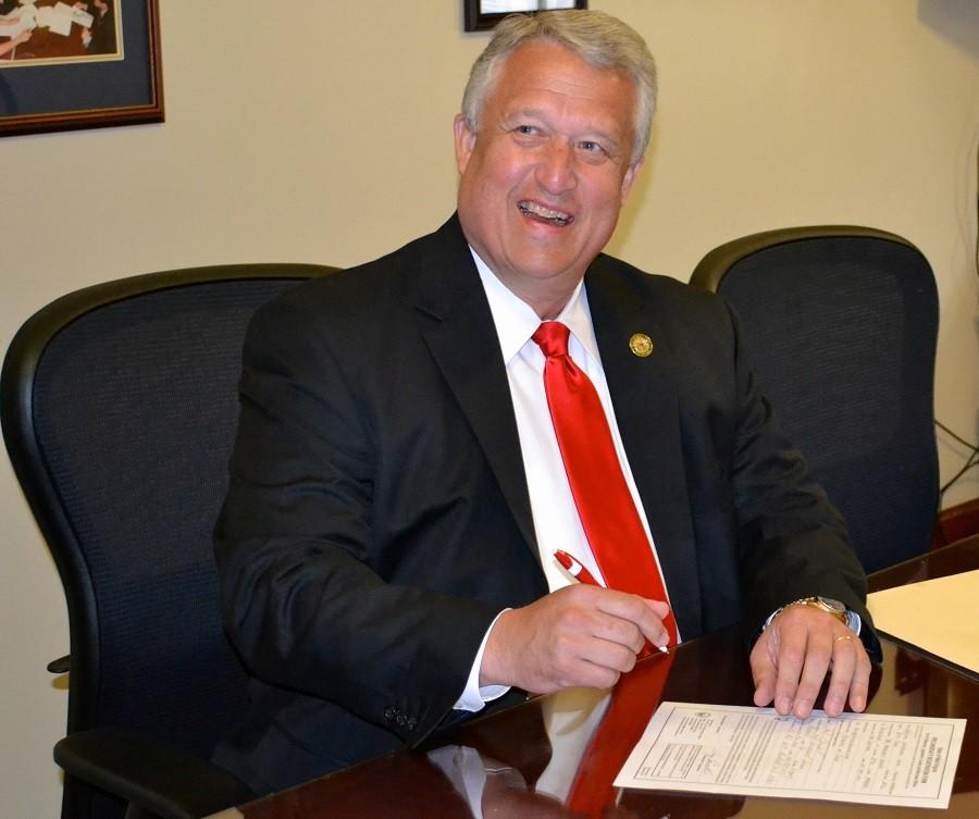 Senate President Bill Cole Signing his 2016 Governor candidacy paper work July 2.