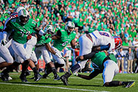 Lexi Browning/The Parthenon
Marshall's Taj Letman takes down Greg Howell as the Thundering Herd takes on Florida Atlantic University on Saturday, Oct. 25 at the Joan C. Edwards Stadium in Huntington.