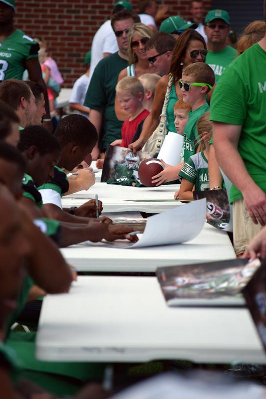 Marshall University football held its annual fan fest Sunday evening. After Thundering Herd players took team photos, they signed autographs and took pictures with hundreds of fans. The Herd opens the 2015 season with a home game against Purdue University on Sept.6.