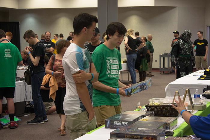 Gage Ross, freshman Chemistry major (left) and Devin Hankins, Freshman Radio/TV Major (right) check out the merchandise at the Retro Video game Convention at the Big Sandy Superstore Arena on Saturday.