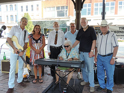 Harmonica Club takes a break from performance for picture.