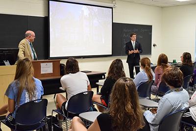 Interim President Gary White and Student Body President Duncan Waugaman teaching UNI 100 to freshman.