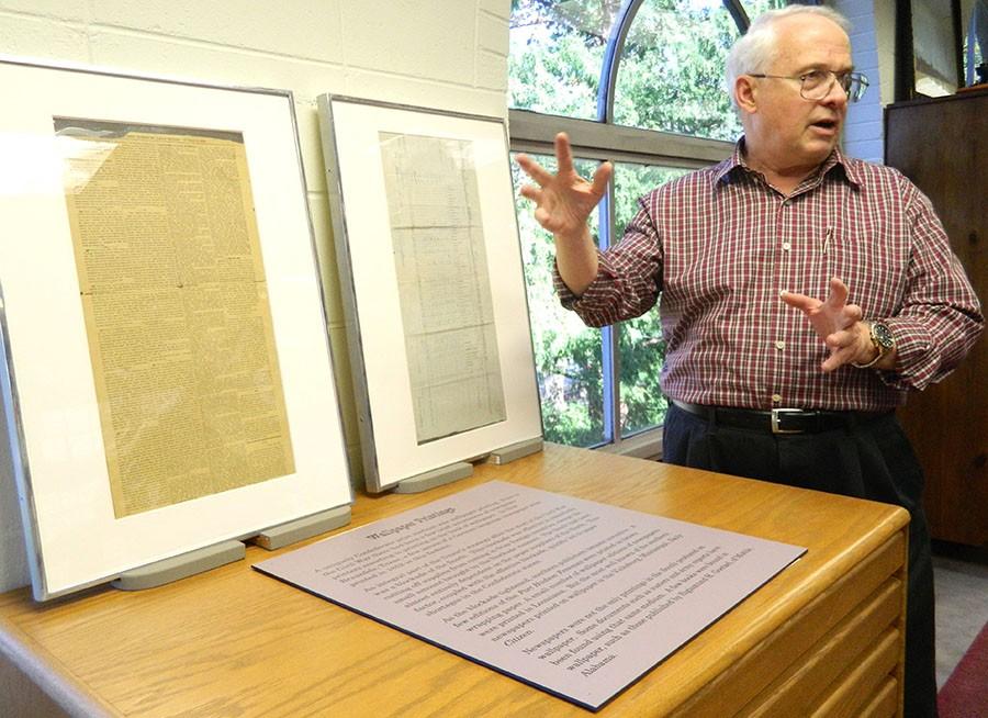 Confederate bibliographer Jim Dickinson showcasing an item featured in the Rosanna Black Library of Confederate History located in Morrow Library.