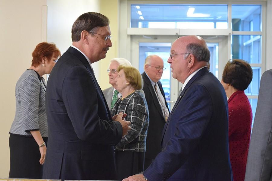 Denis A. Wiesenburg talks with Interim President Gary White during his on campus forum.