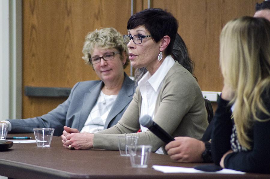 Panelist and nurse practitioner at Cabell-Huntington Health Department Heather Woods (center) answers a question from the audience Wednesday night during the discussion in the Memorial Student Center Room BE5. Woods spoke about the health department’s new needle-exchange program, stating that several of the patients they have served through the program were prostitutes.