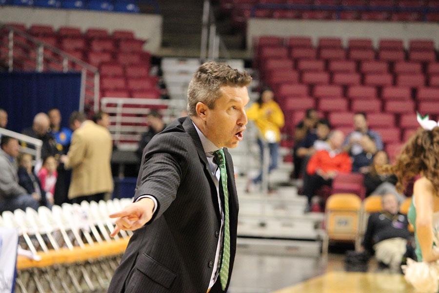 Marshall women's basketball head coach Matt Daniel directs his players from the sidelines in the Charleston Capital Classic last season.