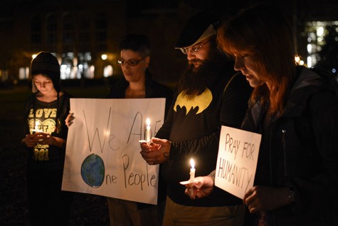 Jessica Thompson, Business Management Major, Saheim Al'Din, Religious Studies Major, and Lina and Harli Miner at the candlelight vigil Tuesday evening.
