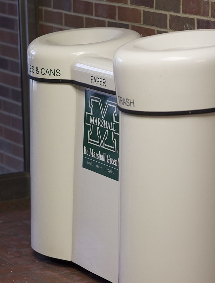 A recycling bin is installed in Twin Towers East to encourage students to recycle bottles, cans and paper conveniently.