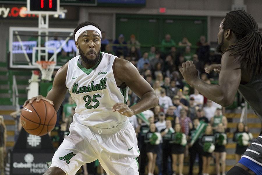 Marshall University junior Ryan Taylor makes a move to the basket against Middle Tennessee State University Thursday at the Cam Henderson Center.