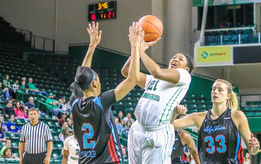 Junior forward Chelsey Romero goes up for a shot in a game last season.