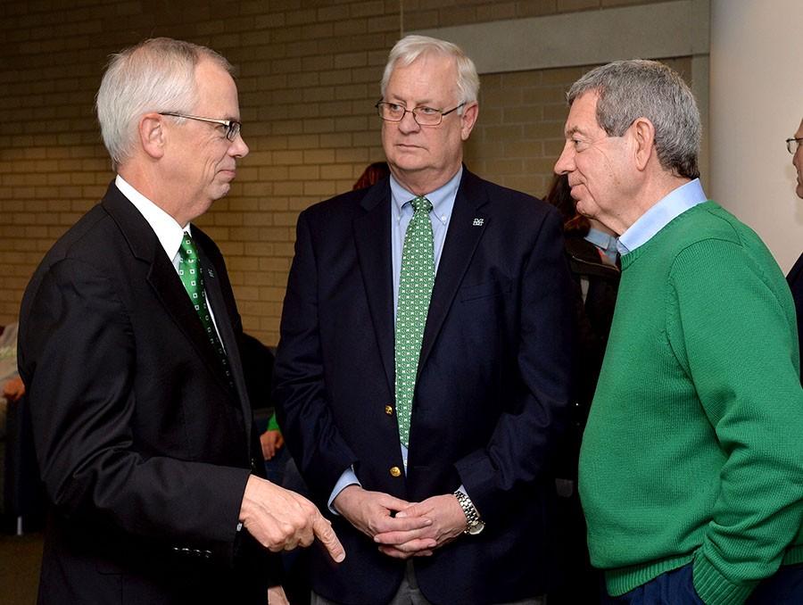 President Gilbert discussing the Center with Director Homer Preece (center) and John Sang, Chairman of the Advisory Board (right).