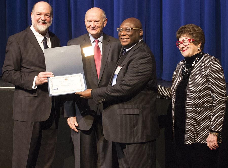 Burnis Morris, Carter G. Woodson Professor of Journalism and Mass Communications, was recognized today as a 2016 History Hero in Charleston at the Culture Center. The History Hero award is a part of History Day at the Capitol and has been going on for 20 years. The director of West Virginia Archives and History, Joe Geiger announced the candidates to receive their awards. This class was a larger class with 50 members. Geiger said a good number of class members attended. “History heroes are those persons who are being recognized by a historical society or geological society for work they’ve done over the previous year or sometimes a lifetime of work they’ve done for that society,” Geiger said. The Carter G. Woodson Foundation nominated Morris for the honor because of his contribution of research to the foundation. David Harris, the treasure of the foundation, said he was excited for Morris to receive the honor because Morris had given him the information to create a living portrayal of Woodson. “I am really honored and thrilled because Dr. Morris had really been an inspiration to me. So I am really happy for him,” Harris said. Morris has conducted valuable research on Woodson since 2011, when he was named a John Deaver Drinko Fellow. Morris said he is excited to receive this once-in-a-lifetime honor. “This is a special experience for me,” Morris said. Morris said he is grateful for the recognition even though he had no idea he was being nominated. “Oh, it feels great, I’m just humbled,” Morris said. The five History Heroes from Cabell County met delegate Jim Morgan and took photos with him. Morgan said it is important to recognize these people because they help us remember the past, which will help us in the future. “I think History Hero Day is an important day in West Virginia because it allows us to honor those who have done so much to keep the past alive for us,” Morgan said. Morgan said he is proud of the county he represents. “It’s great to have five people who have contributed this year in our History Heroes,” Morgan said. Every year history and genealogy organizations choose an individual they believe goes above and beyond to serve them and they are honored as a History Hero. Cheyenne DeBolt can be contacted at debolt2@marshall.edu.