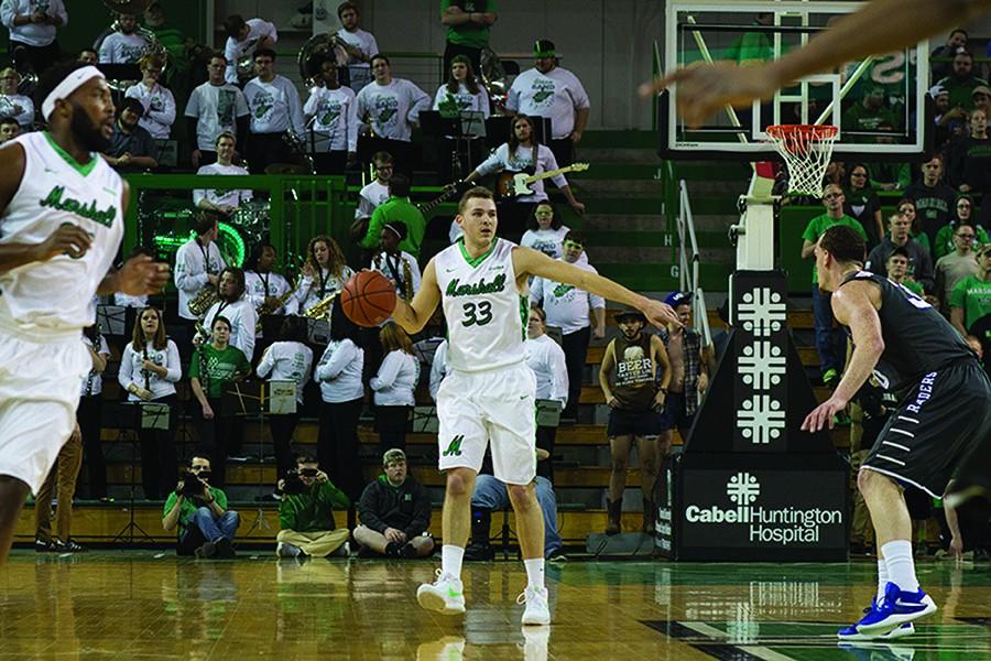 Marshall University sophomore guard Jon Elmore brings the ball up the court during a game earlier this season at the Cam Henderson Center.