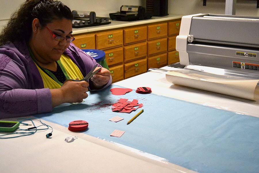 Katlyn Fitzpatrick, a grad student studying multicategorical special education, is seen utilizing the crafting station at the LRC, February 2, 2016.