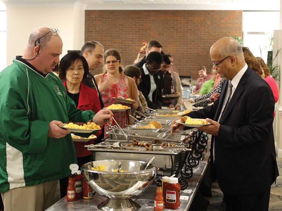 Faculty and staff make their way down the buffet during the Diversity Breakfast at 7:30 a.m. Monday in the Don Morris Room of the Memorial Student Center.