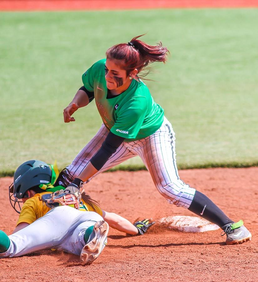 Marshall University sophomore Elicia D’Orazio tags a player out during a game last season at Dot Hicks Field.