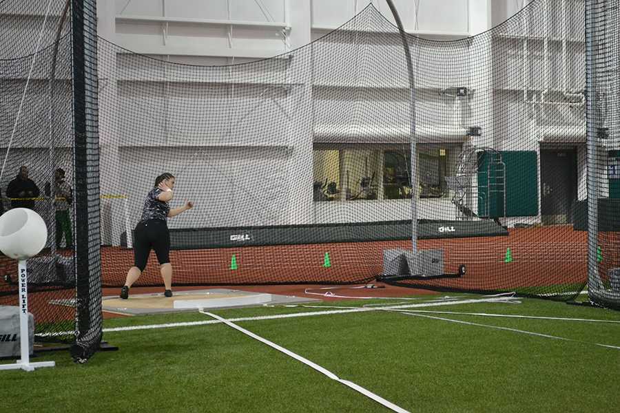Marshall University junior Mercedes Dowell goes to throw a discus during a match earlier this season at the Chris Cline Athletic Complex.