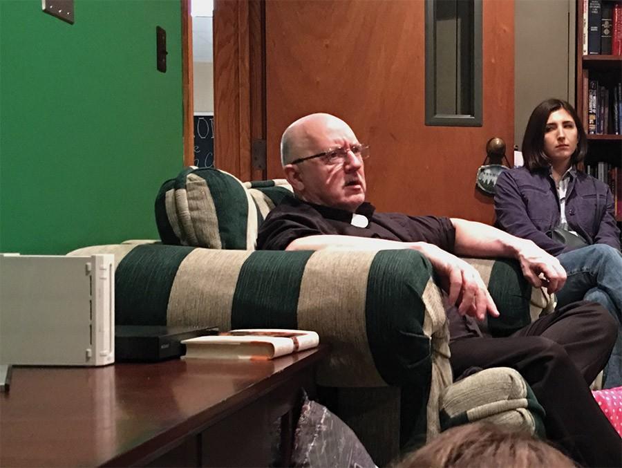 The campus parish Father Dean addresses students questions Thursday at the Catholic Newman Center.
