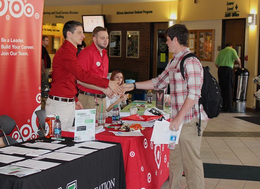 (From Left) Dave Reszkowski and Taylor Legan greet student Jake Hunter while representing Target at Job-A-Palooza, March 16, 2016