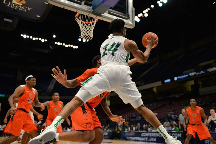 Marshalls CJ Burks (14) leaps for a pass as the Herd take on UTEP during the Conference USA men’s basketball quarterfinals on Thursday, March 10 in Birmingham, AL.