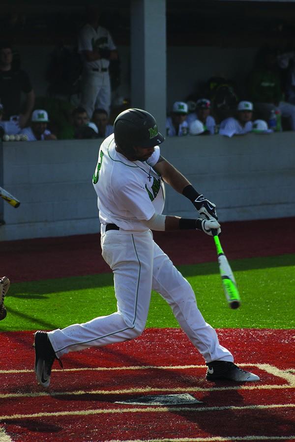 Marshall second baseman DJ Gee swings at a pitch in a game earlier this season. Gee recorded the go-ahead RBI in both Herd victories over the weekend.