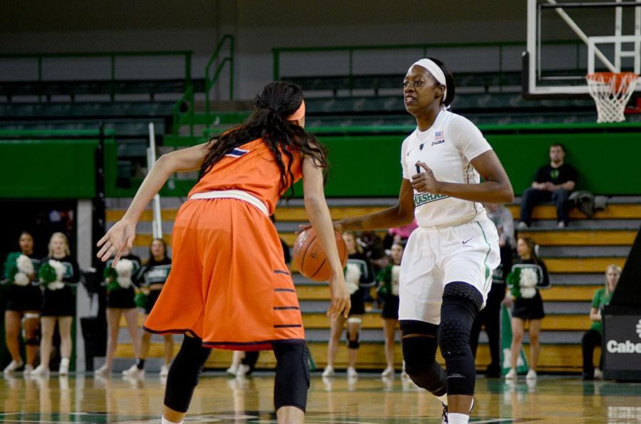 Marshall University senior guard Leah Scott brings the ball up the court Feb. 2 at the Cam Henderson Center against the University of Texas at El Paso.