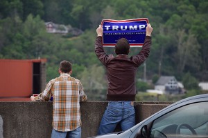 (From Right) Trevor Napper and Dustin Perry protest the Bernie Sanders rally holding signs advocating for Donald Trump, April 26, 2016.