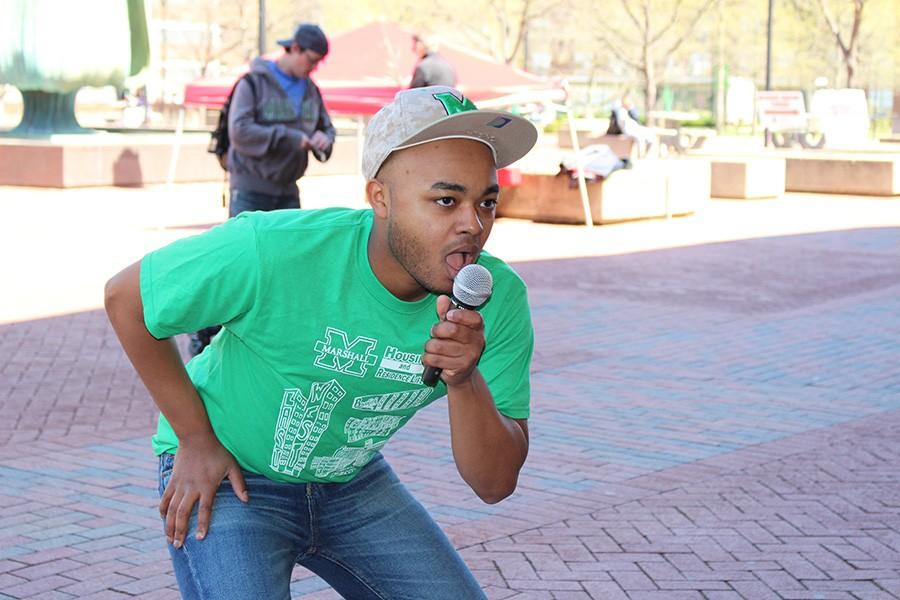 Marshall student and CAB member Anthony Bady lip-syncing at the MSC’s plaza to promote CAB’s upcoming events, “CAB presents Lip Sync Battle.”